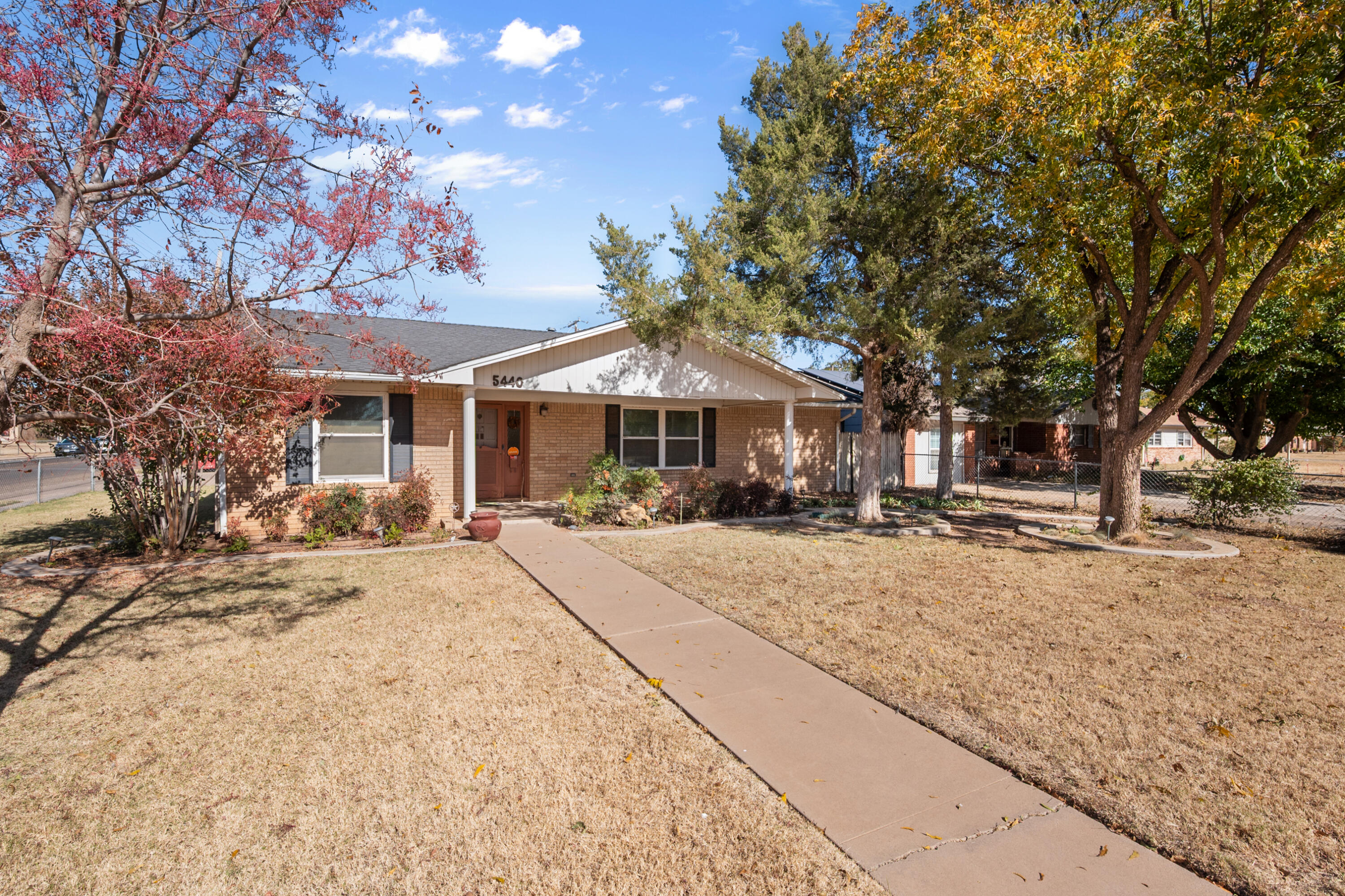 5440 48th Street Lubbock, TX 79414 - Photo 3 of 28 a house with trees in front of it
