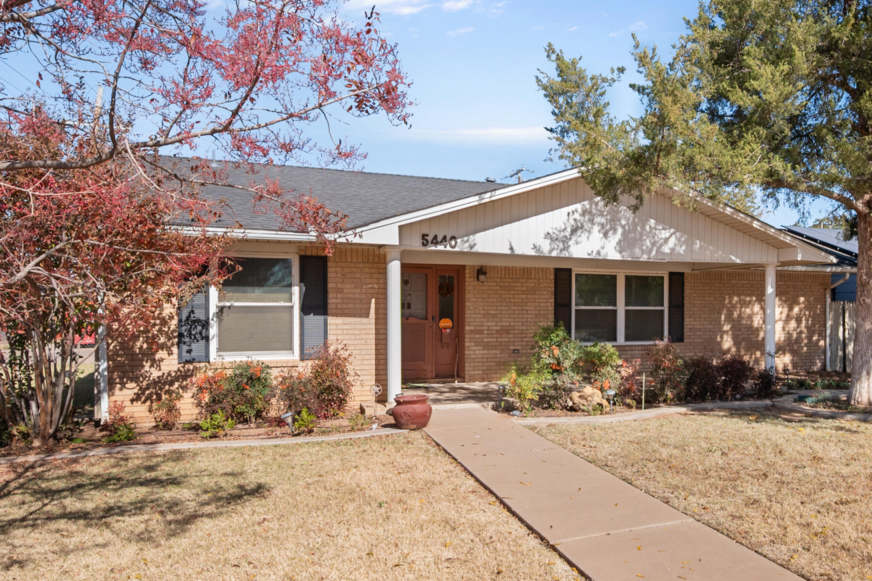 5440 48th Street Lubbock, TX 79414 - Photo 4 of 28 front view of a house with a yard