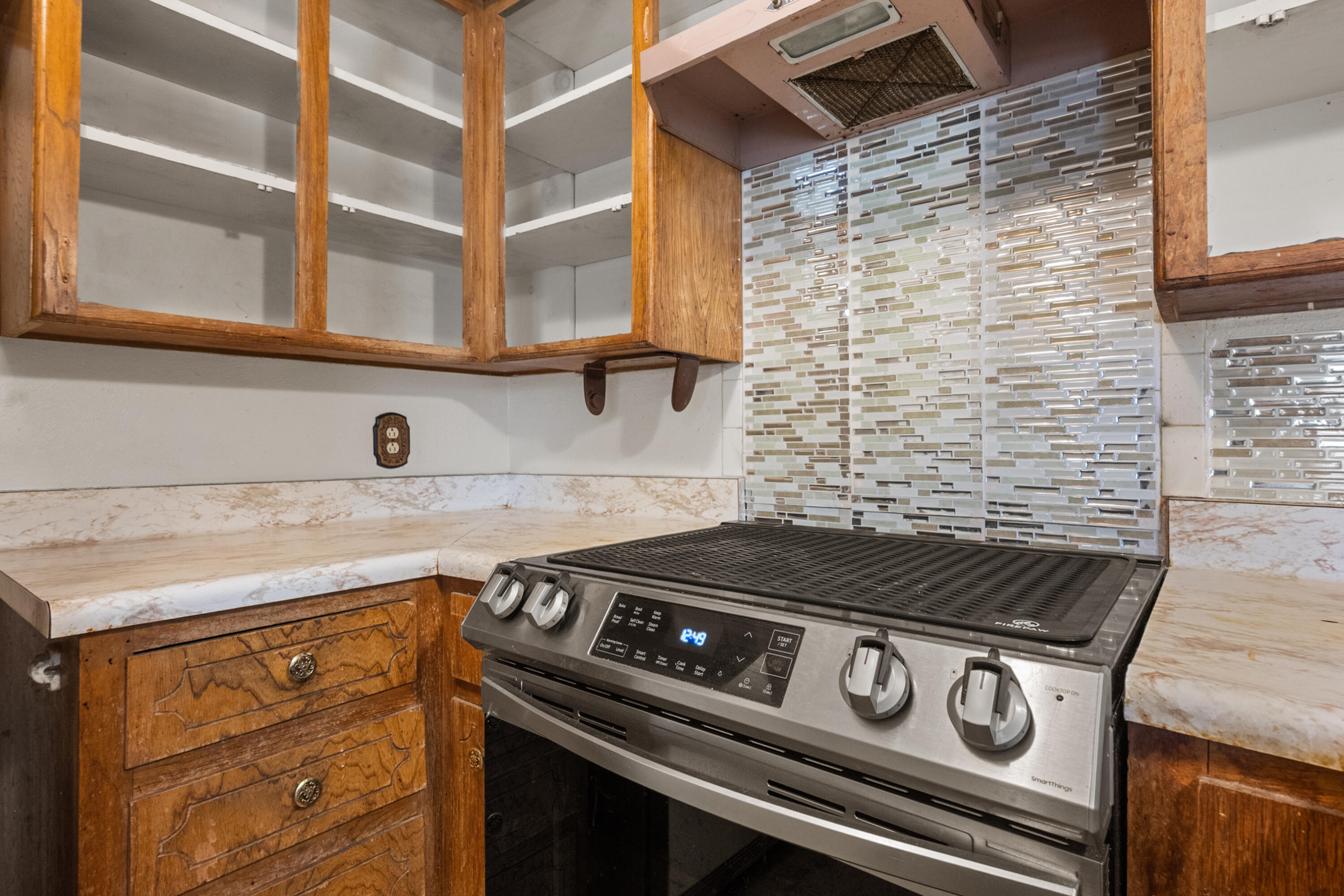 5440 48th Street Lubbock, TX 79414 - Photo 10 of 28 a kitchen with a stove and a sink