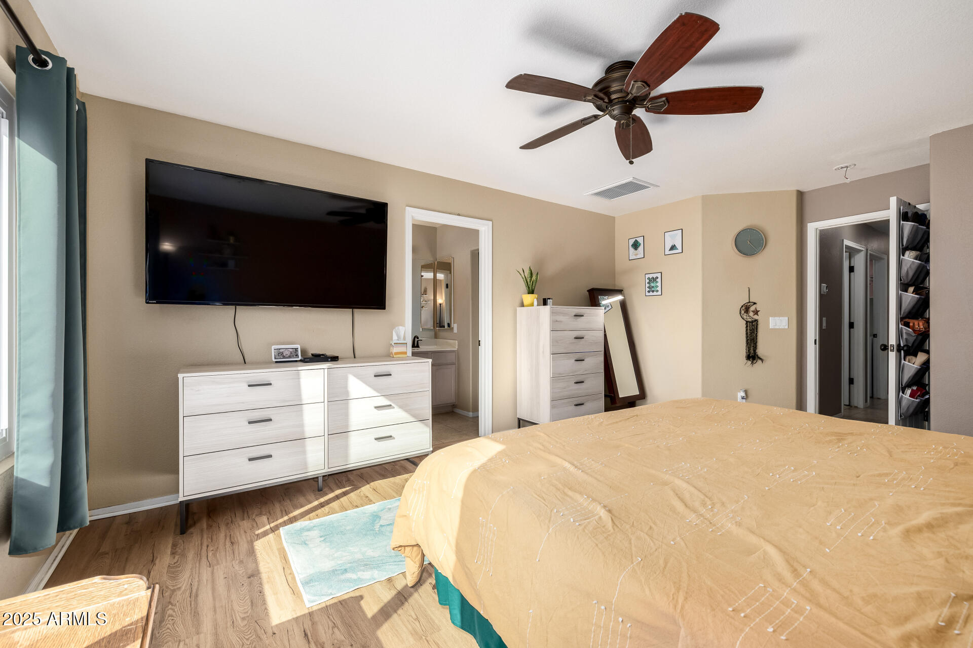 1675 East Robin Lane Gilbert, AZ 85296 - Photo 15 of 29 a room with a bed and a flat screen tv