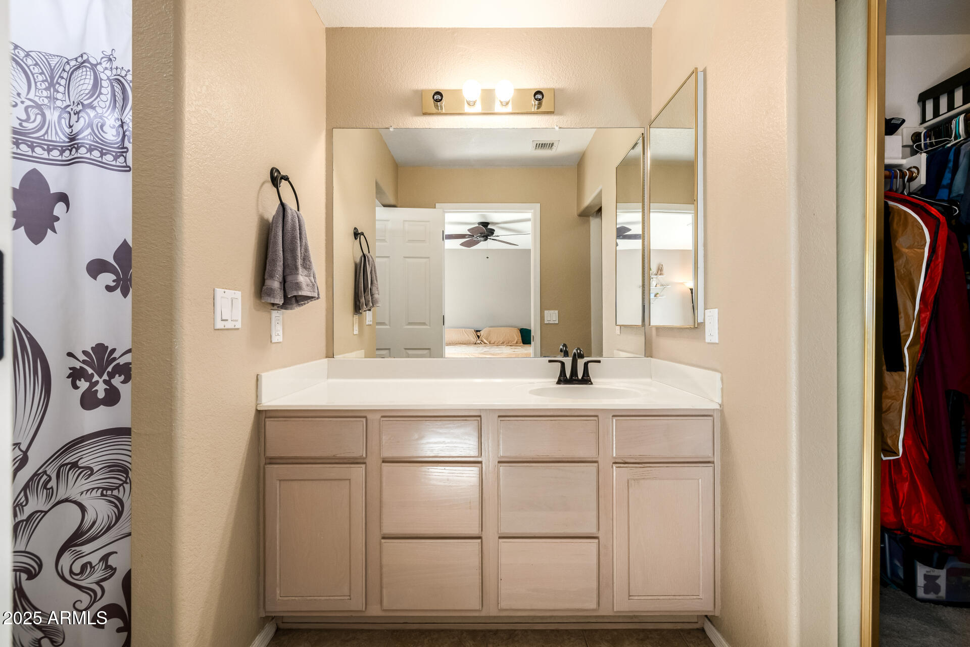 1675 East Robin Lane Gilbert, AZ 85296 - Photo 18 of 29 a bathroom with a sink and a mirror