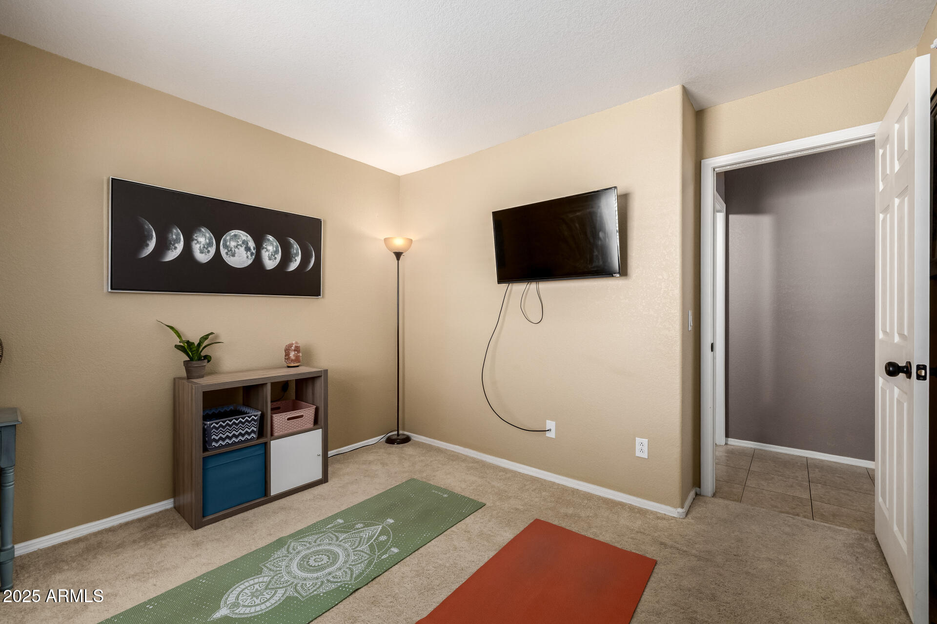 1675 East Robin Lane Gilbert, AZ 85296 - Photo 21 of 29 a living room with furniture and a flat screen tv