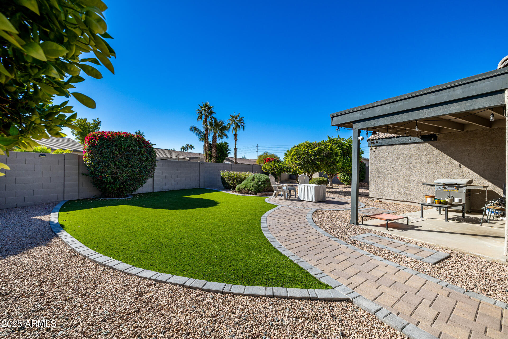 1675 East Robin Lane Gilbert, AZ 85296 - Photo 26 of 29 a view of a backyard with sitting area