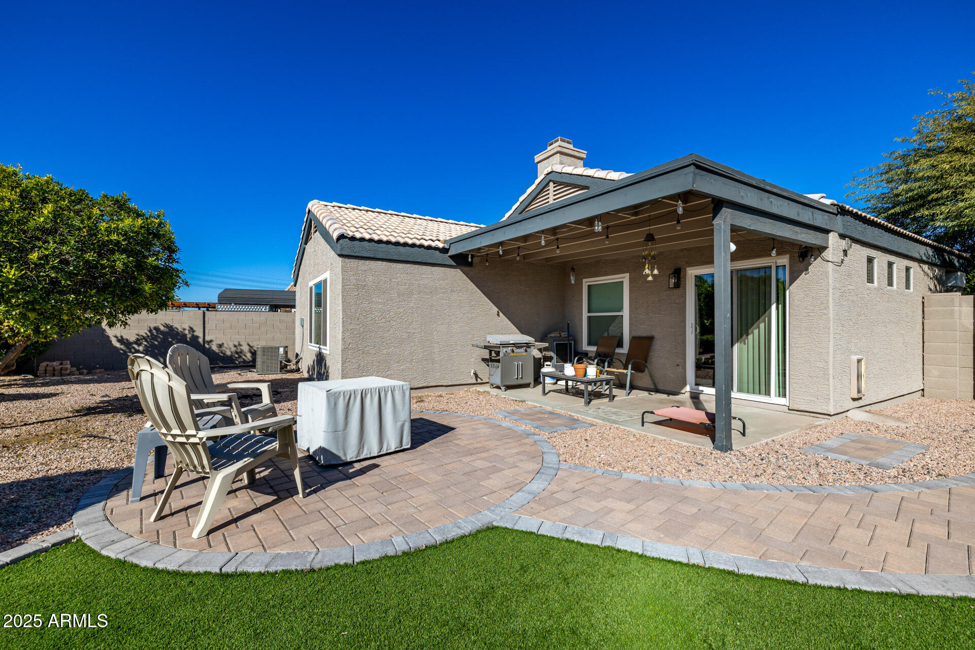 1675 East Robin Lane Gilbert, AZ 85296 - Photo 27 of 29 a view of a house with backyard porch and sitting area