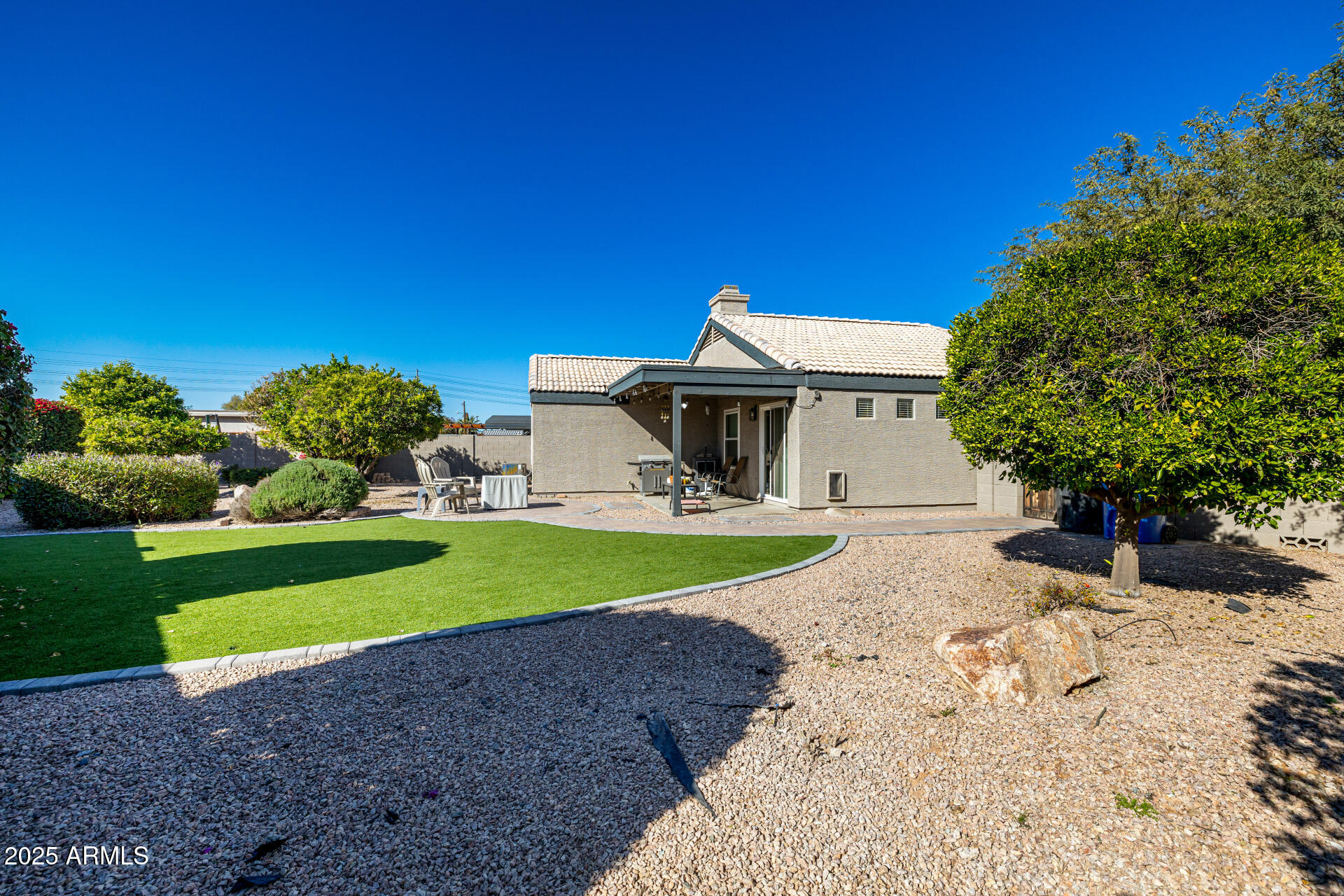 1675 East Robin Lane Gilbert, AZ 85296 - Photo 28 of 29 a front view of a house with a yard