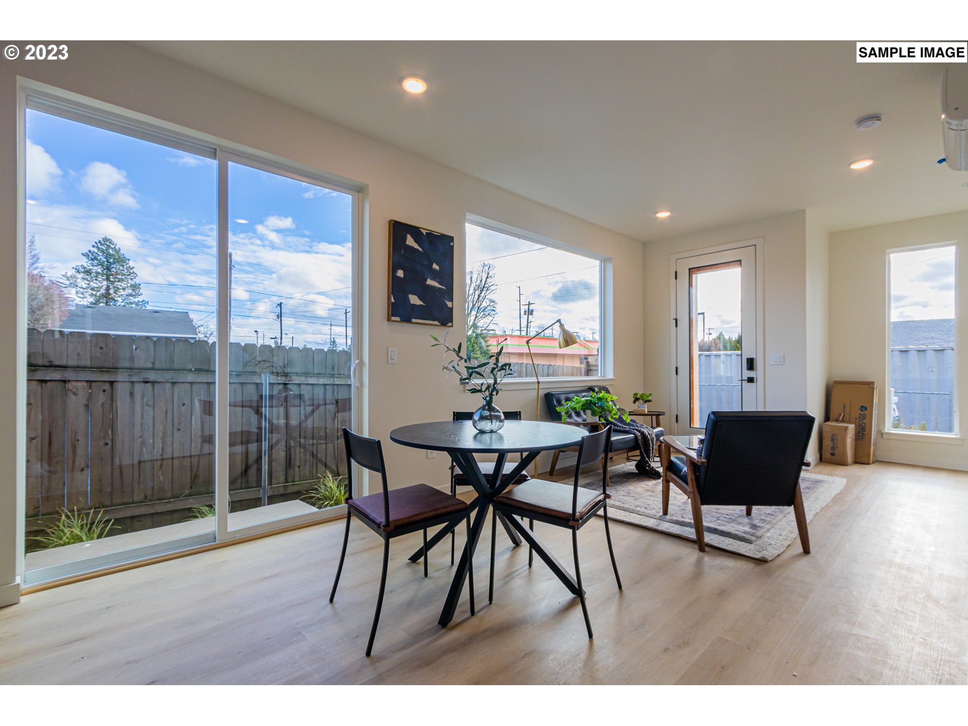 12063 Southeast Oak Street Portland, OR 97216 - Photo 3 of 11 a view of a dining room with furniture window and wooden floor