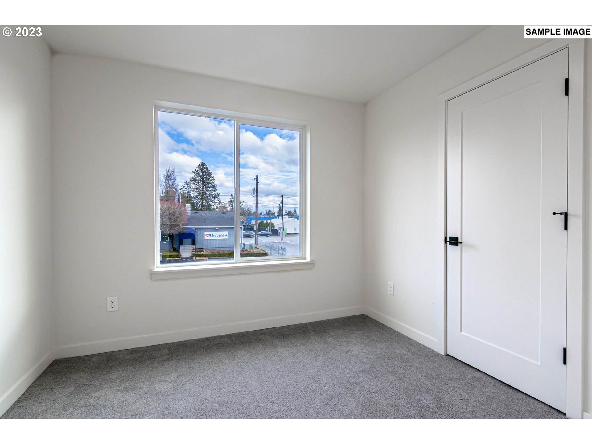 12063 Southeast Oak Street Portland, OR 97216 - Photo 9 of 11 a view of an empty room with a window