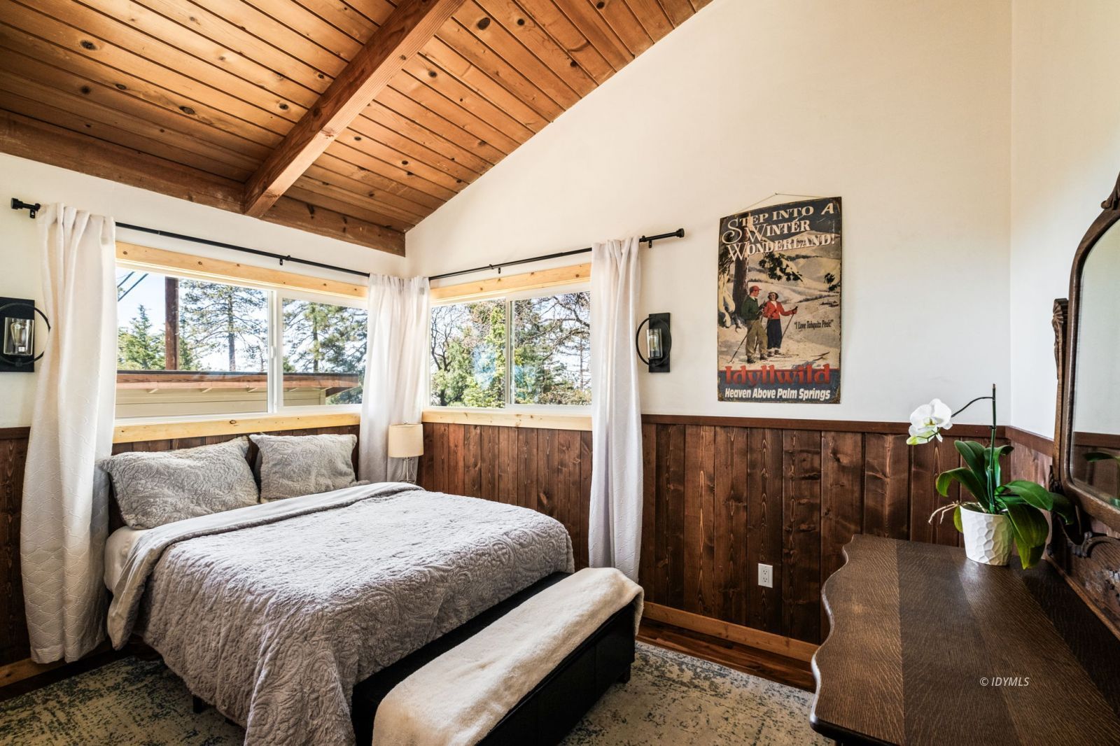 24750 Marion Ridge Drive Idyllwild, CA 92549 - Photo 32 of 45 a bedroom with a bed and wooden floor