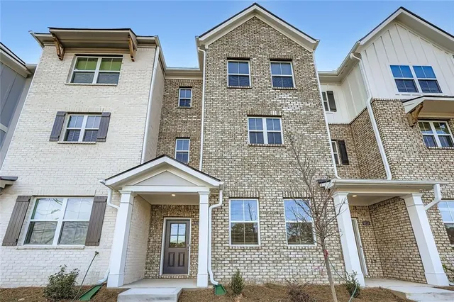 a front view of a house with glass windows