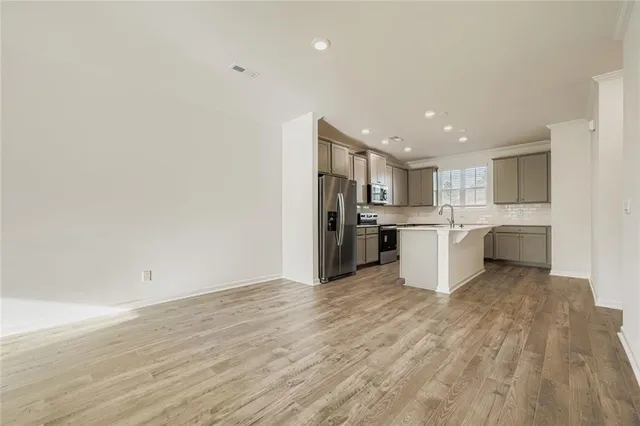 a view of kitchen with wooden floor