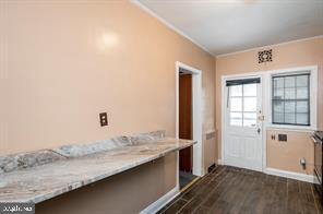 1618 Roundhill Road Baltimore, MD 21218 - Photo 16 of 50 a view of a kitchen with a sink and wooden floor