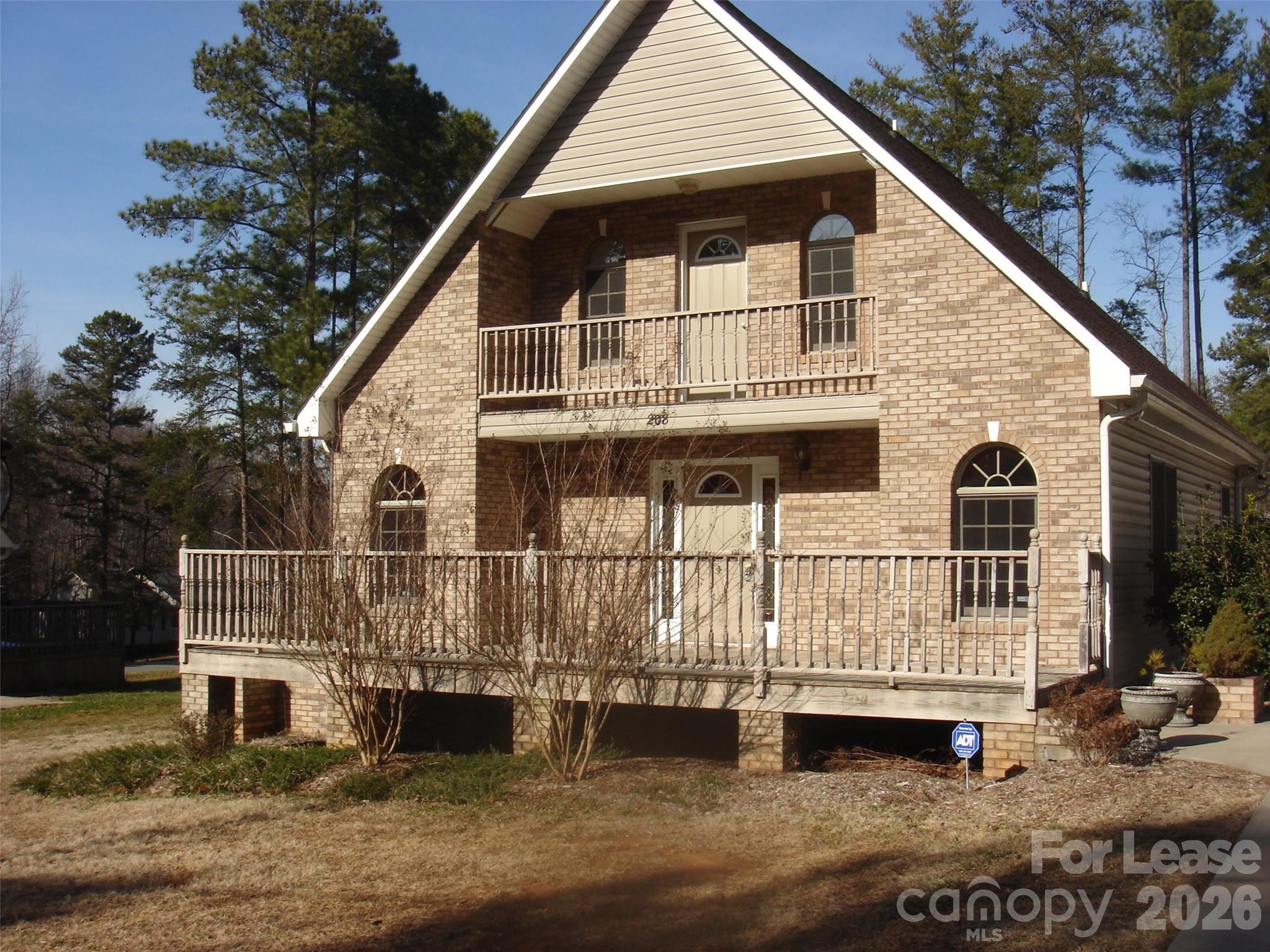 208 Chuckwood Road Mooresville, NC 28117 - Photo 1 of 15 a front view of a house with a balcony