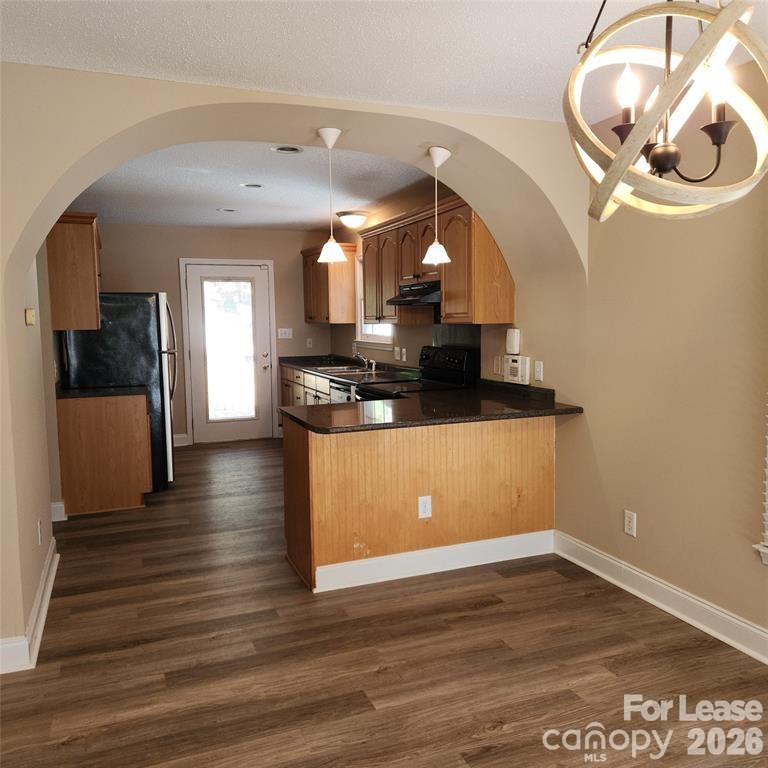 208 Chuckwood Road Mooresville, NC 28117 - Photo 5 of 15 a view of a room with wooden floor