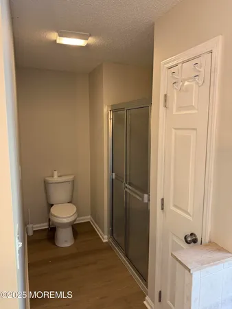 a white toilet sitting next to a bathroom sink