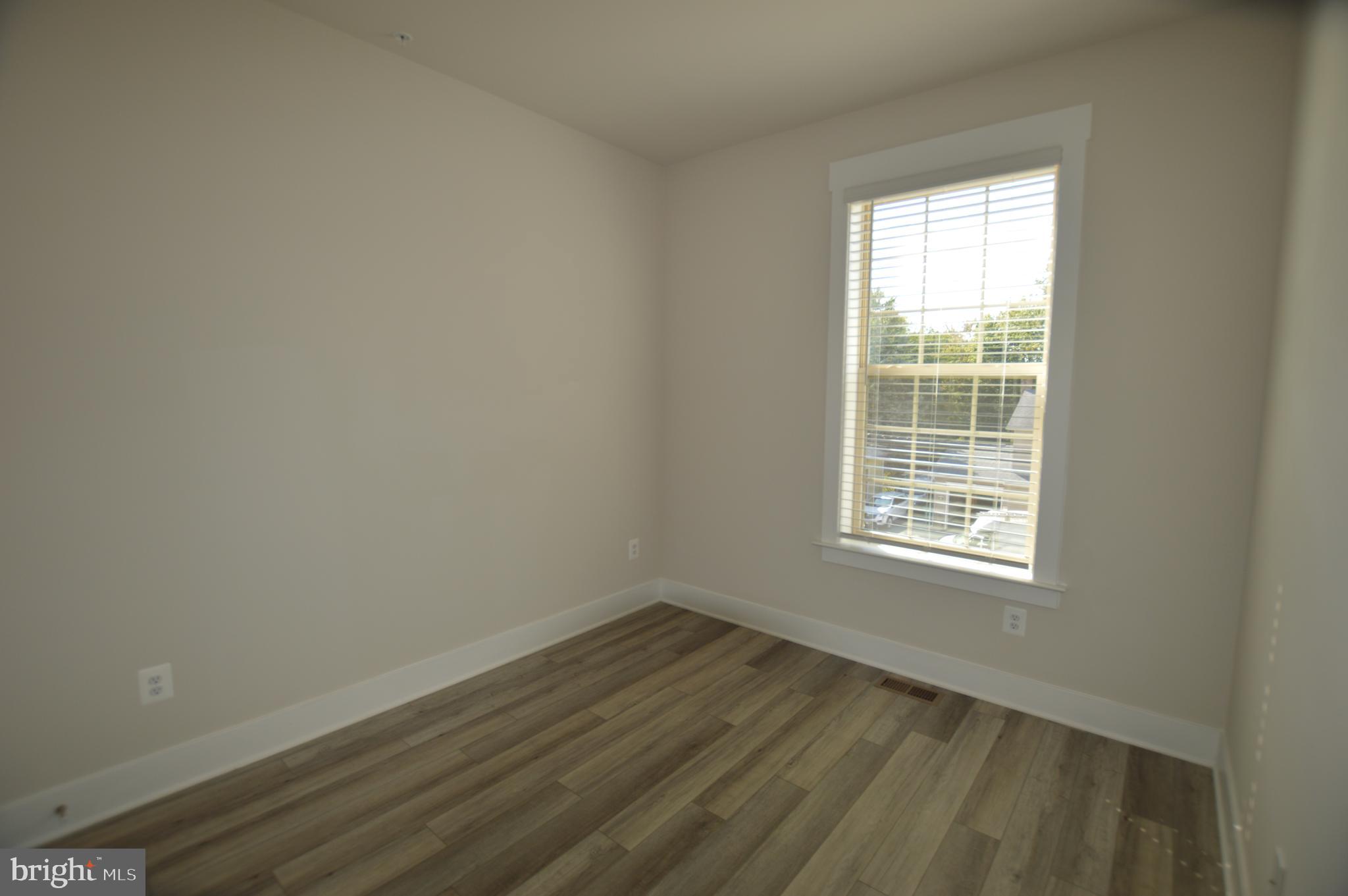 7927 Wormans Mill Road Frederick, MD 21701 - Photo 13 of 17 an empty room with a window