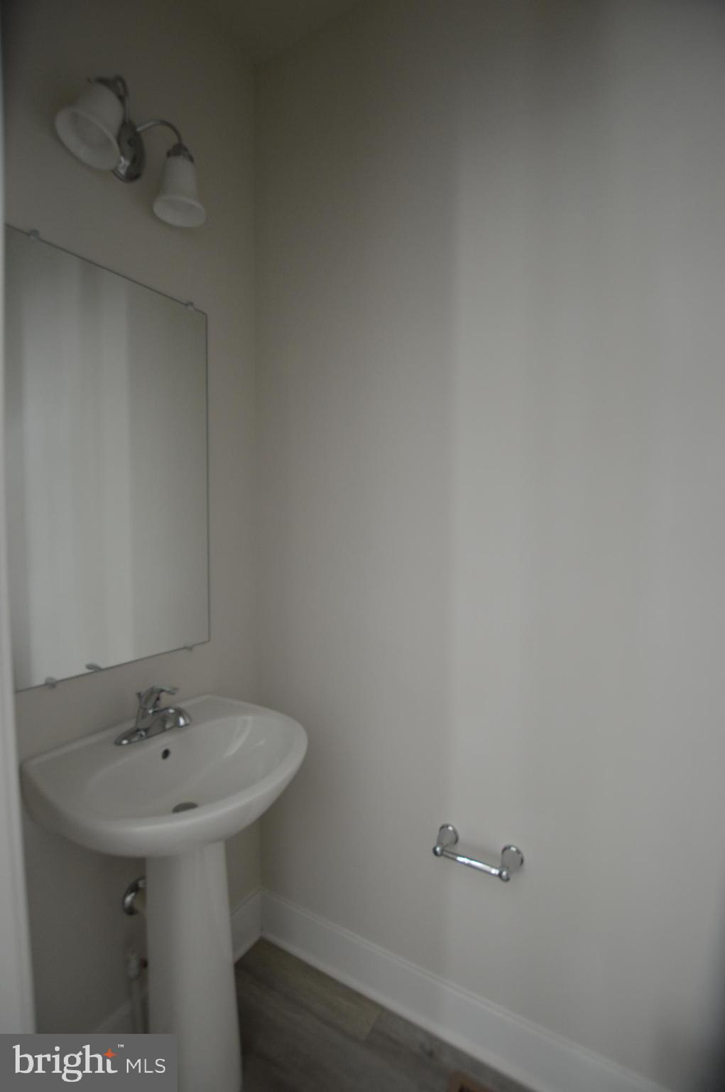 7927 Wormans Mill Road Frederick, MD 21701 - Photo 7 of 17 a bathroom with a sink and mirror