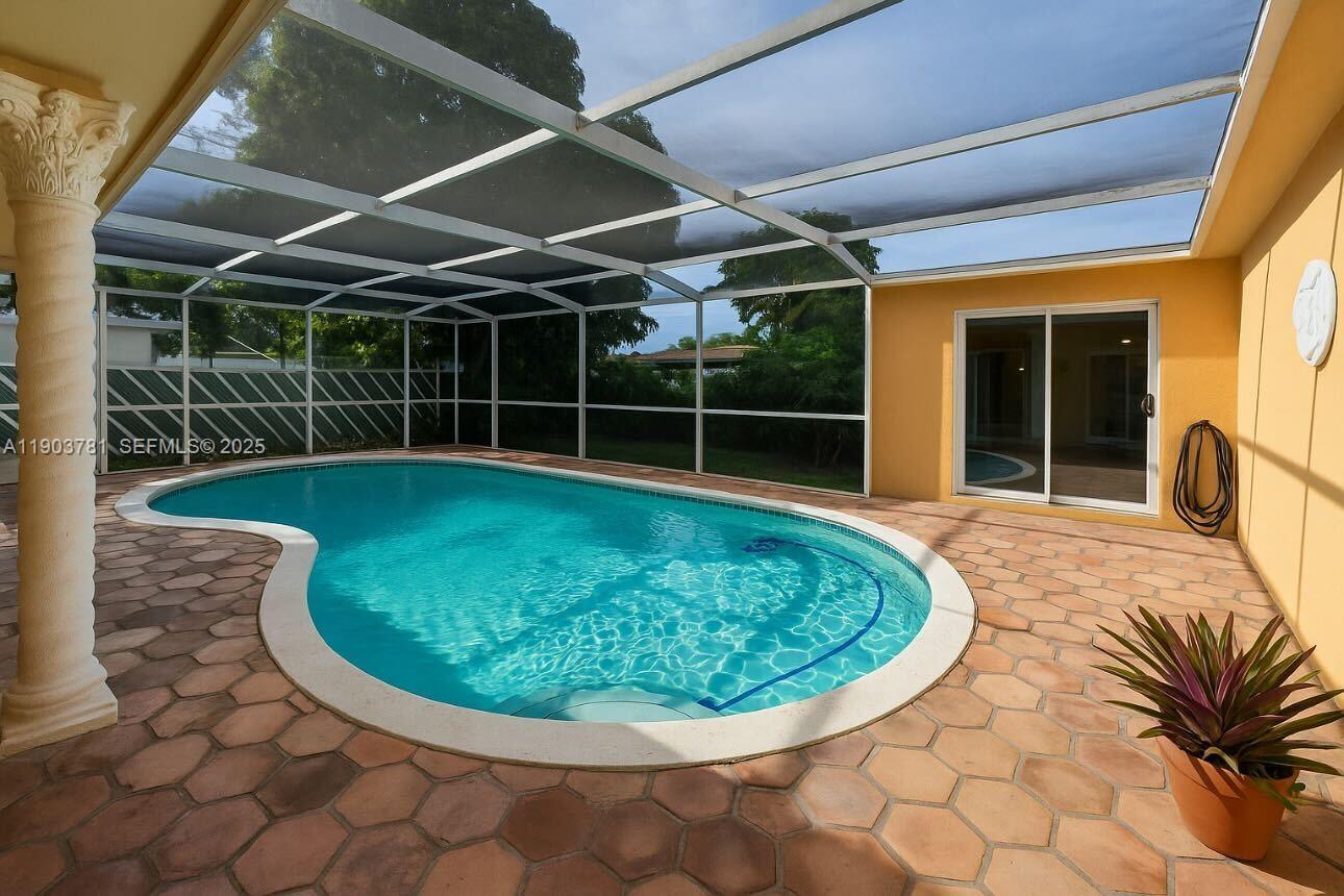 a view of a swimming pools under an umbrella