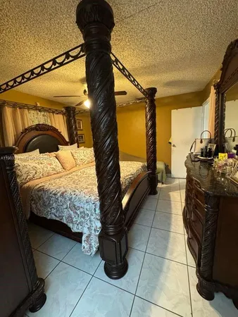 a bedroom with a bed and walk in closet