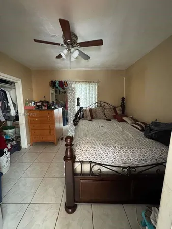 a bedroom with a bed and dresser