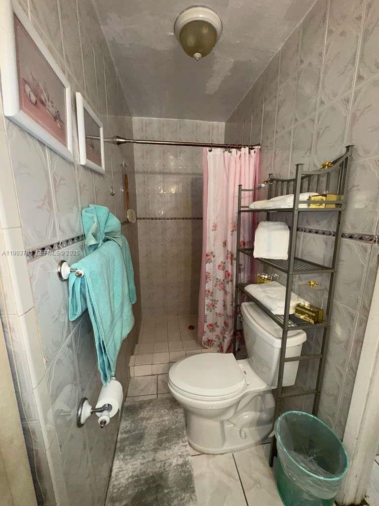 6391 Southwest 34th Street Miramar, FL 33023 - Photo 16 of 21 a bathroom with a toilet and a shower