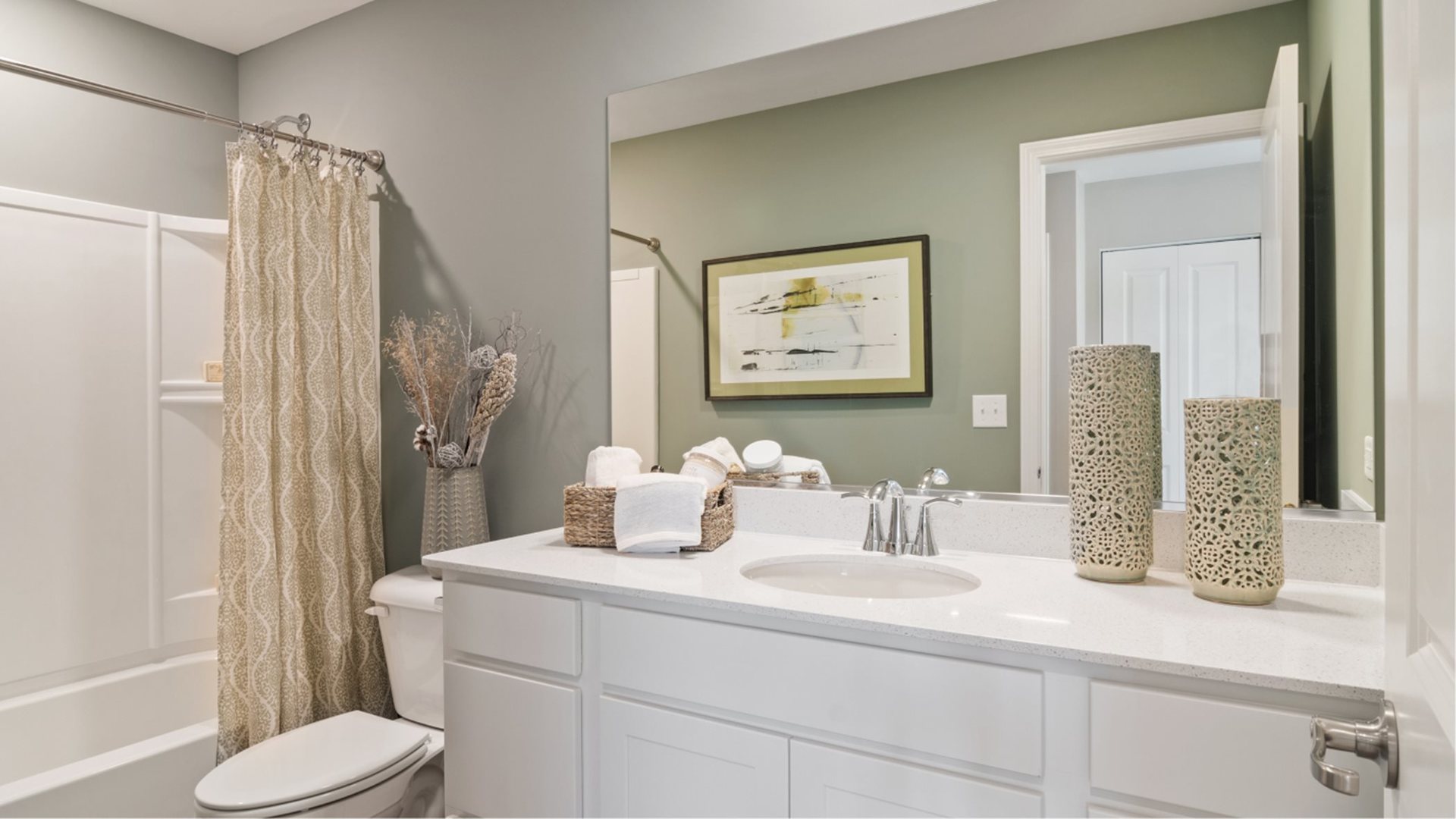 346 Danforth Way Oswego, IL 60543 - Photo 13 of 14 a bathroom with a sink a toilet and shower curtain