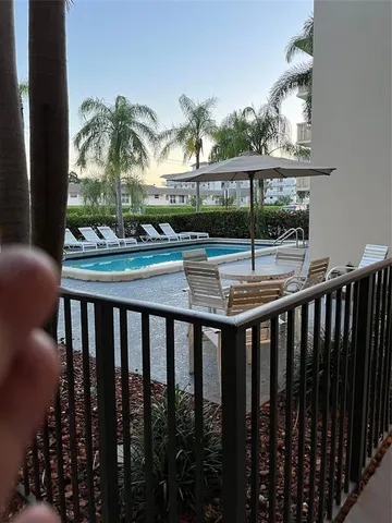a view of swimming pool from a balcony