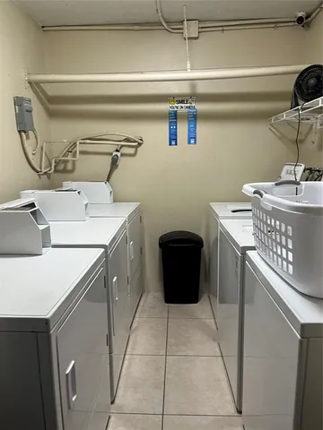 a utility room with a sink a washer and dryer