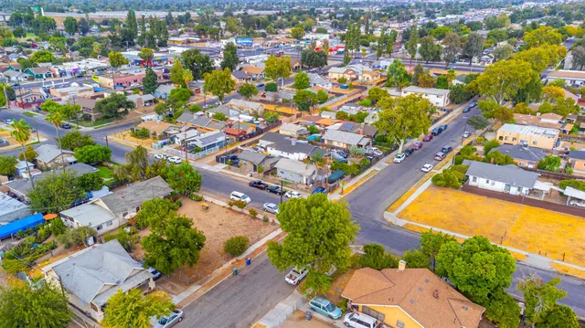 an aerial view of residential houses with outdoor space