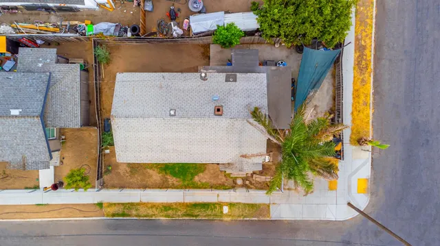 an aerial view of a house with swimming pool