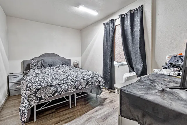 a bedroom with a bed and a walk in closet