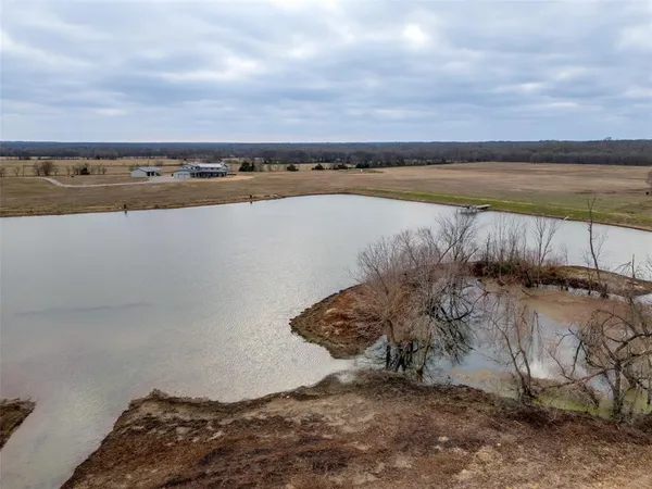 a view of a lake with a yard