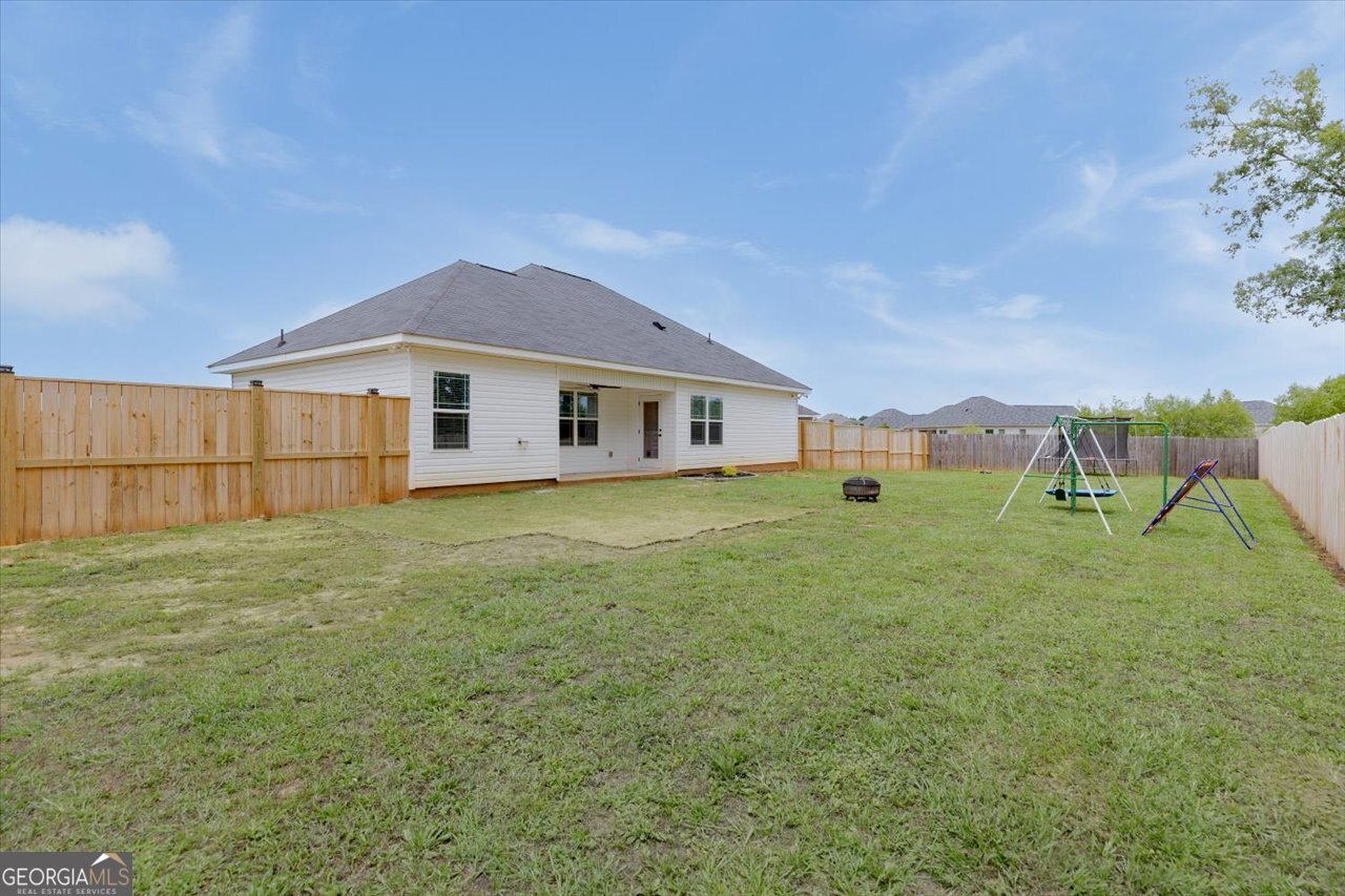 104 Meredith Layne Court Perry, GA 31069 - Photo 45 of 46 a view of a house with a yard and sitting area