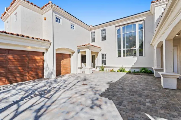a front view of a house with yard