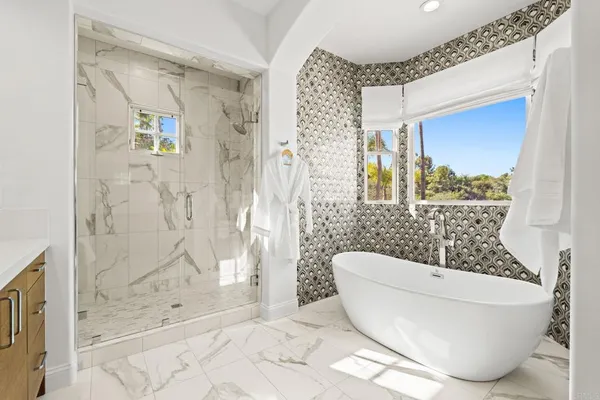 a bathroom with a bathtub and shower