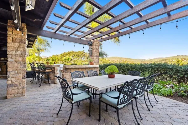 a view of a table and chairs in the patio