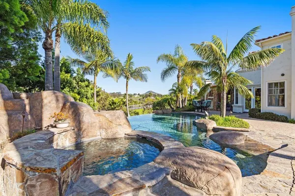 a view of yard along with palm trees