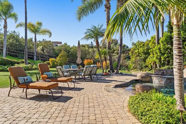 a view of a backyard with a patio