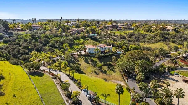 an aerial view of residential building with parking space