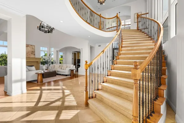 a view of entryway livingroom and hall with wooden floor