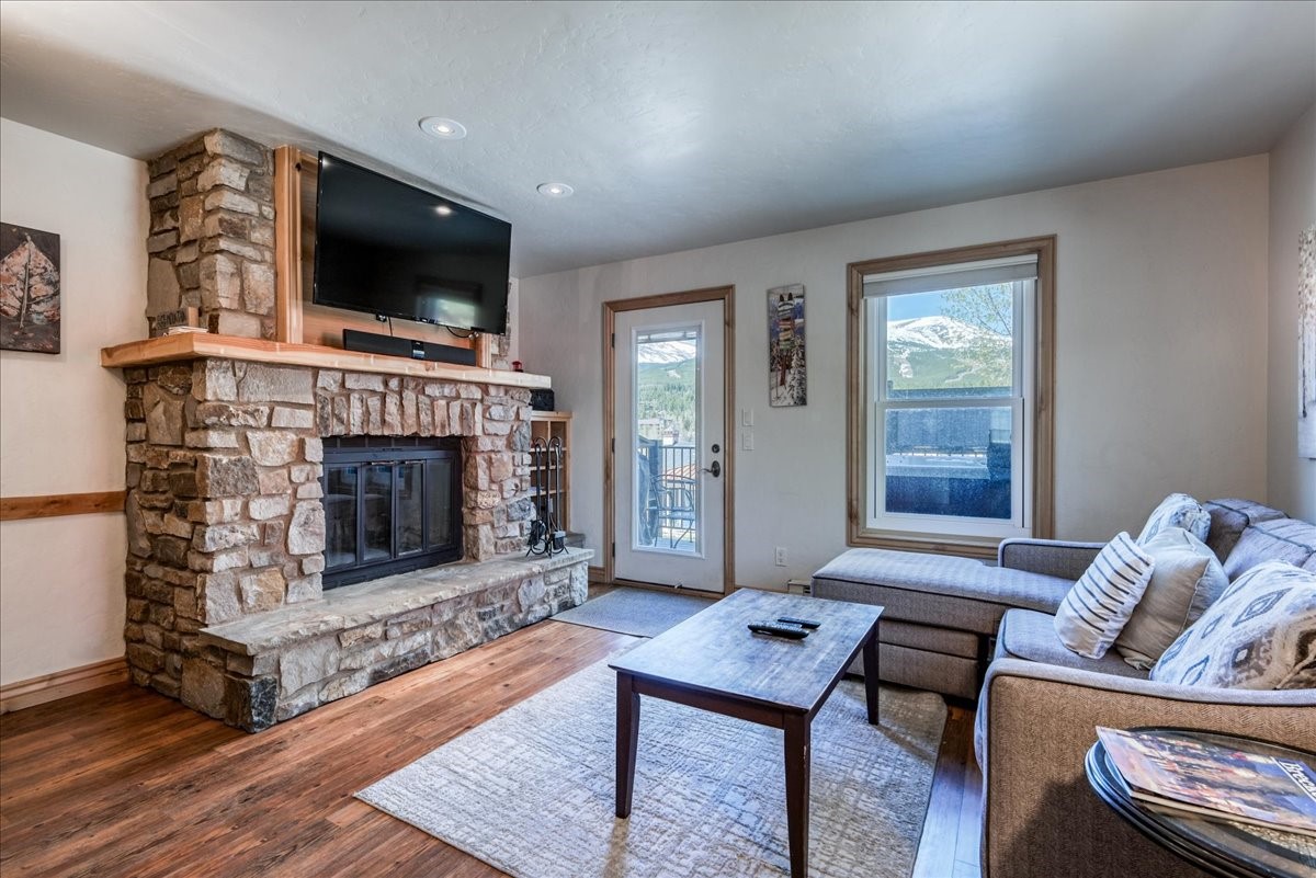 200 North Ridge Street, Unit R A Breckenridge, CO 80424 - Photo 14 of 38 a living room with furniture a flat screen tv and a fireplace