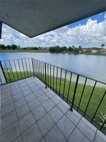 a view of a lake from a balcony