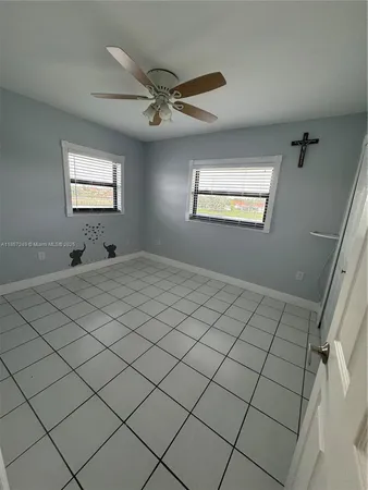 a view of a livingroom and window