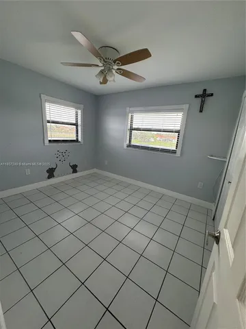 a view of a livingroom and window