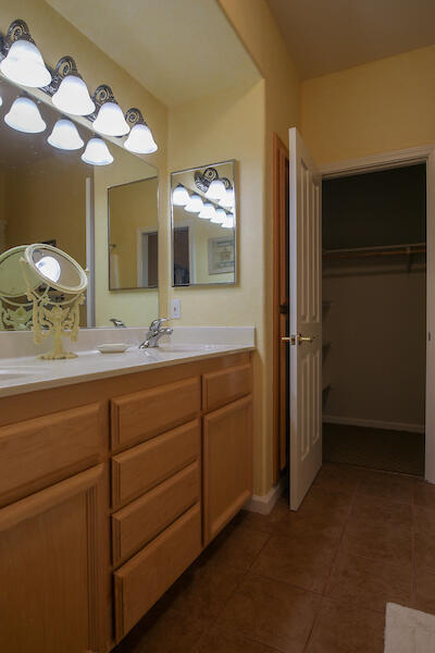 1050 Spring Road Shelter Cove, CA 95589 - Photo 26 of 42 a bathroom with a double vanity sink and a mirror