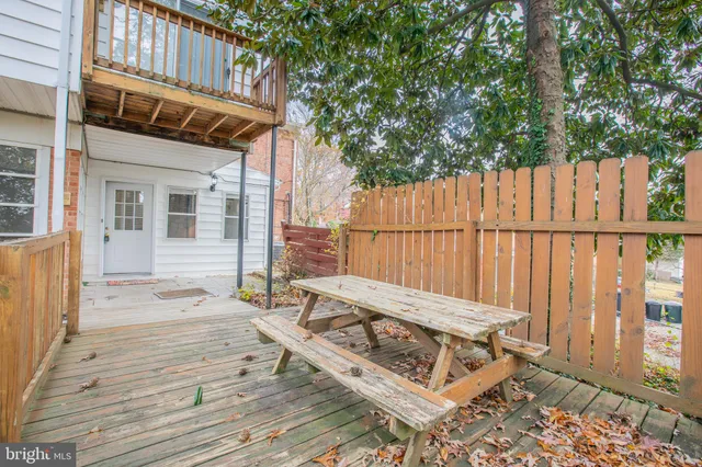 a view of a wooden bench on the house