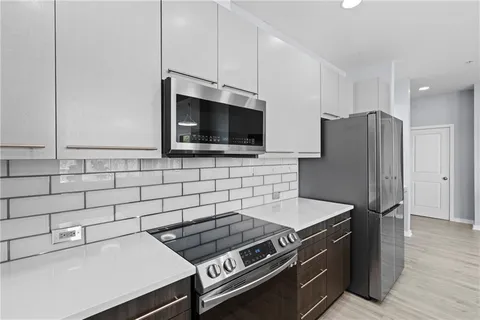 a kitchen with a sink and large window
