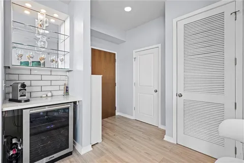 a bedroom with a bed and a chair