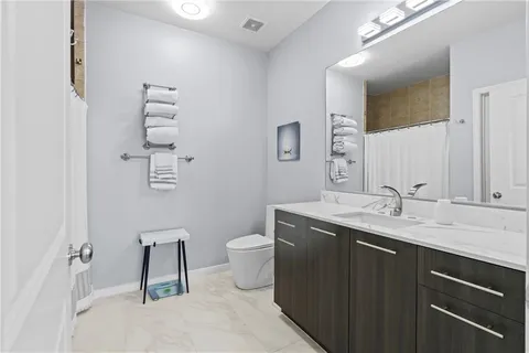a bedroom with a bed and a dresser