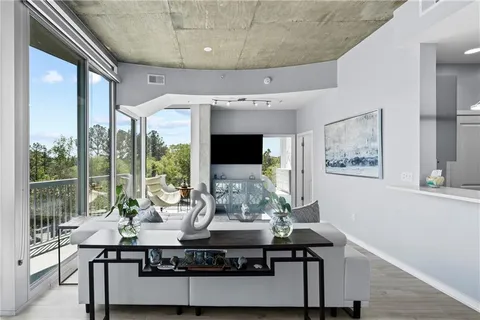 a view of a livingroom with furniture window and outside view
