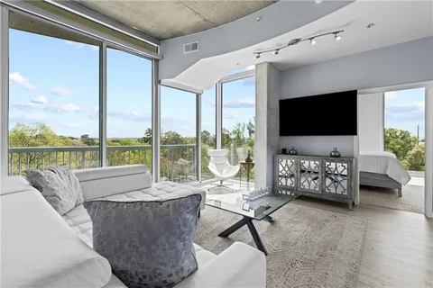 a living room with furniture and a flat screen tv